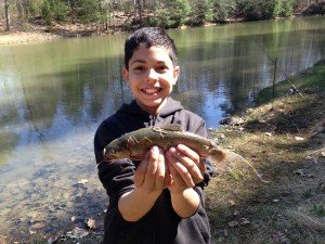 Christian proudly showing off his brook trout
