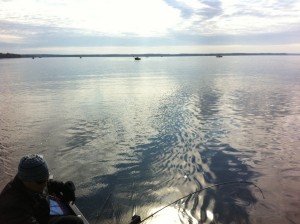 Boat traffic in front of the Crooked River on Sebago Lake in Maine