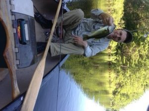 A small largemouth bass caught in the Presumpscot River between the boat launch and the pond