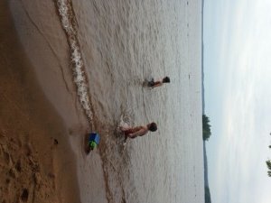 Splashing in the water at one of the beaches at Sebago Lake State Park