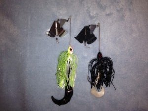 Two buzzbaits with contrasting color schemes. Note the little "clickers" next to the propellers.