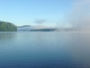 The fog over Panther Pond is being burned off by the rising sun