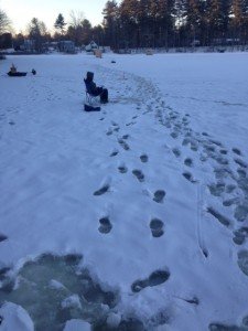 Christian is jigging. Notice the ice shacks by the boat launch.